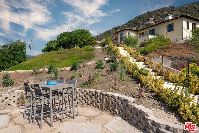 view of patio / terrace with a mountain view