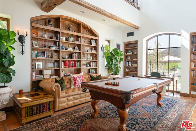 game room with beamed ceiling, a high ceiling, billiards, and tile patterned flooring