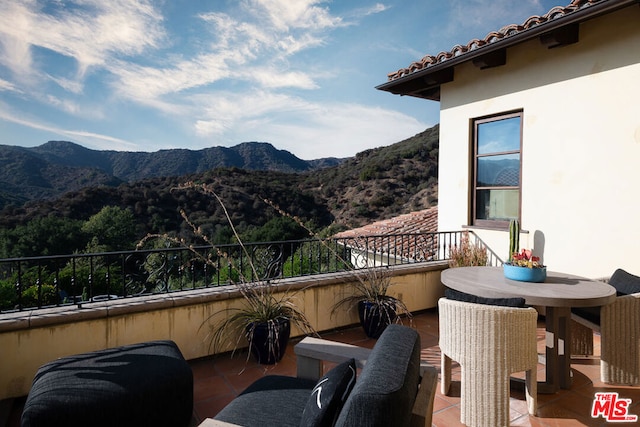 balcony featuring a mountain view