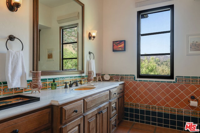 bathroom featuring vanity, tile walls, and tile patterned floors