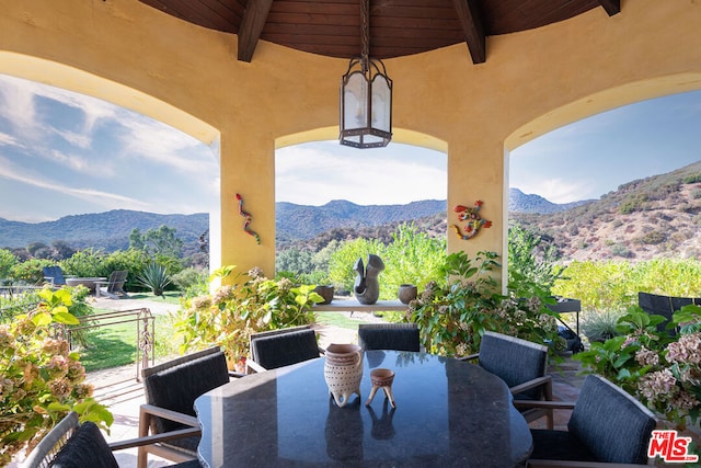 view of patio / terrace with a mountain view