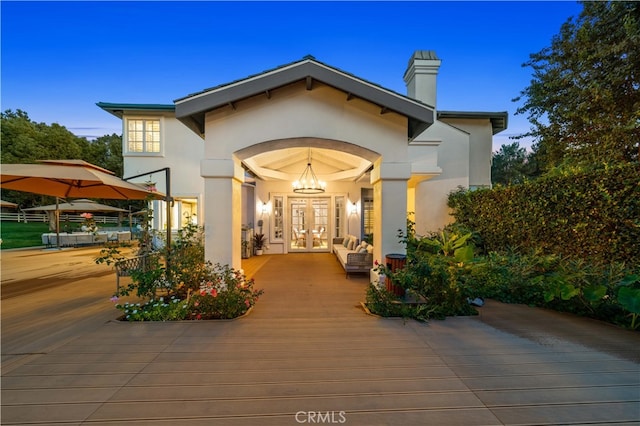 exterior entry at dusk with french doors