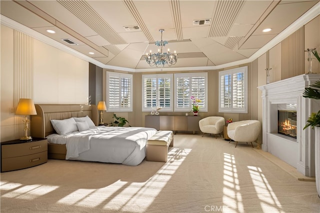 carpeted bedroom featuring crown molding and an inviting chandelier