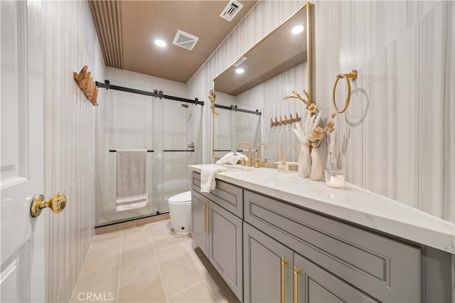 bathroom with walk in shower, tile patterned flooring, vanity, and toilet