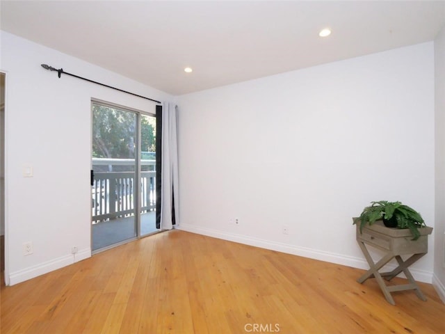 empty room with wood-type flooring