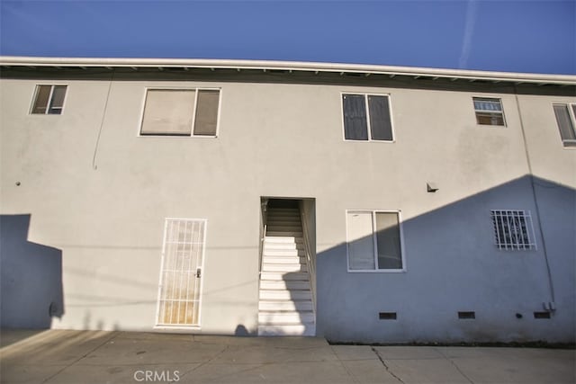 rear view of house featuring a patio