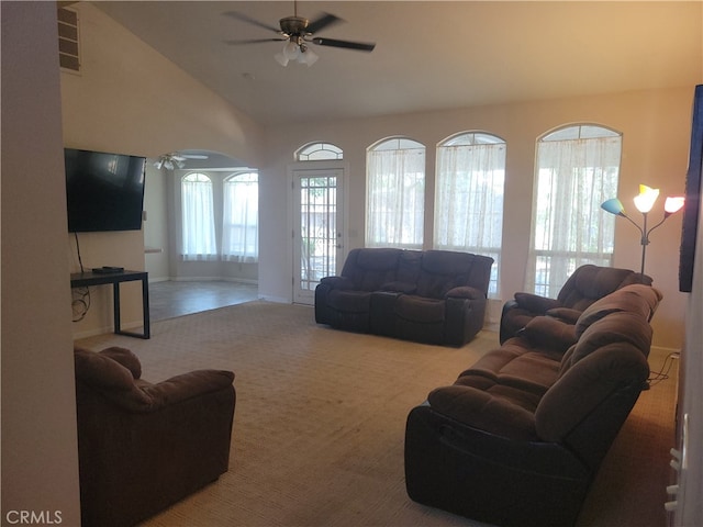 carpeted living room with vaulted ceiling and ceiling fan