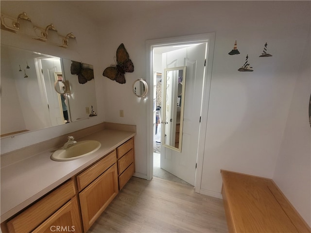 bathroom with vanity and hardwood / wood-style floors