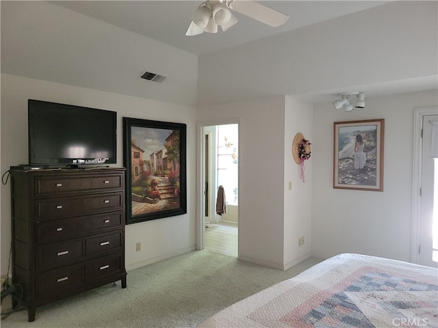 carpeted bedroom featuring lofted ceiling and ceiling fan