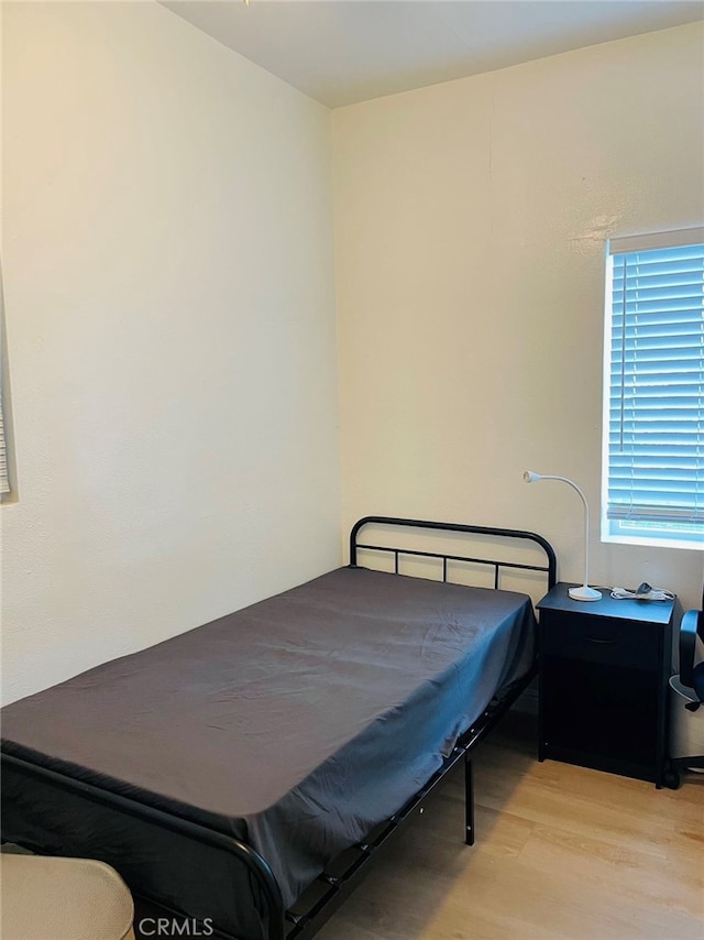 bedroom with light wood-type flooring