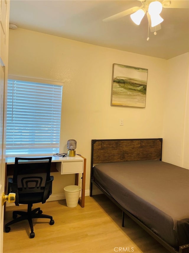 bedroom featuring ceiling fan and light wood-type flooring