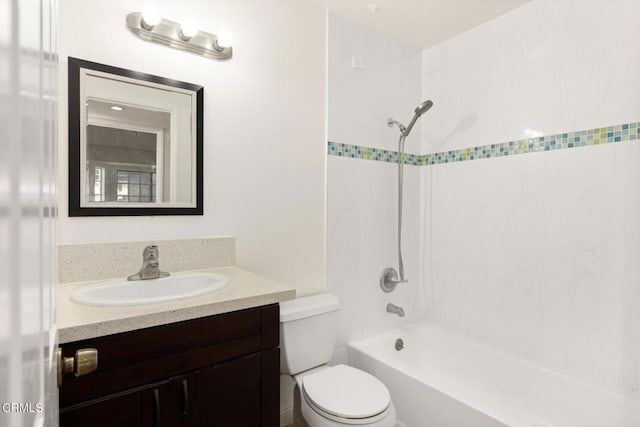 bathroom featuring toilet, shower / washtub combination, and vanity