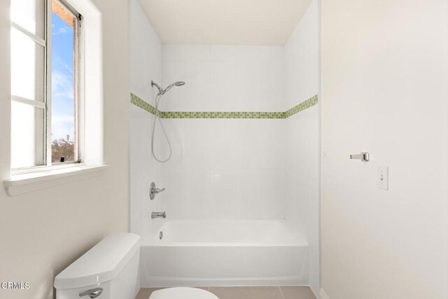 bathroom with toilet, bathtub / shower combination, and tile patterned flooring