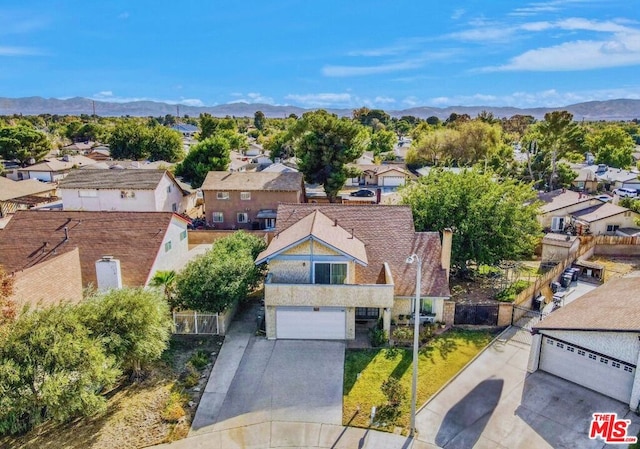 birds eye view of property with a mountain view