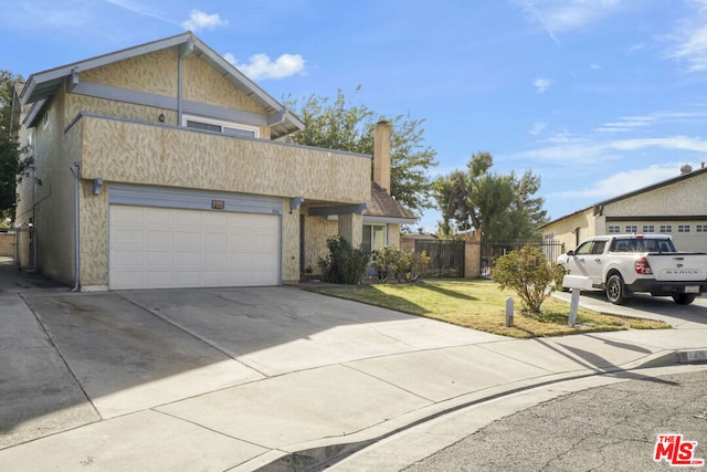 view of front facade with a garage and a front yard