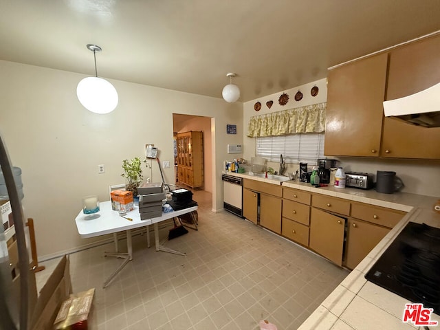 kitchen featuring cooktop, dishwasher, pendant lighting, and sink