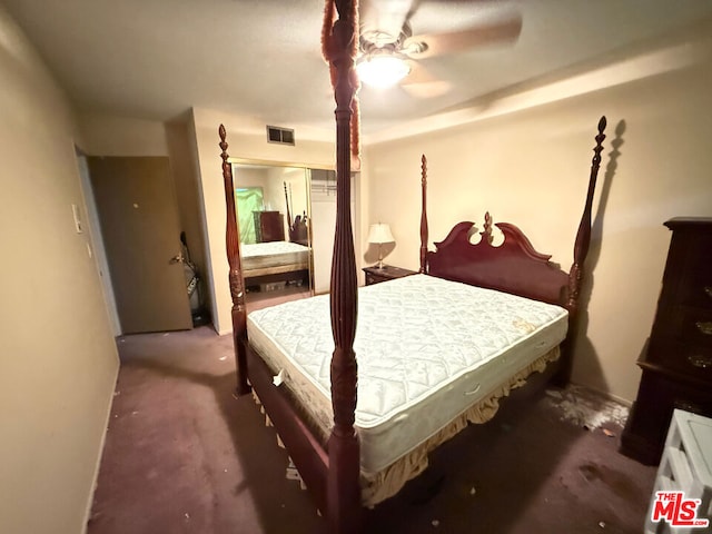 bedroom with dark carpet and ceiling fan