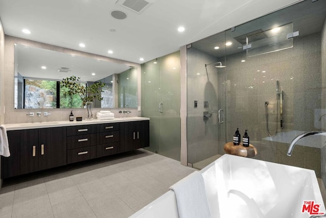 bathroom with separate shower and tub, tile patterned floors, and vanity