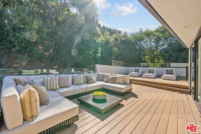 wooden deck featuring an outdoor living space