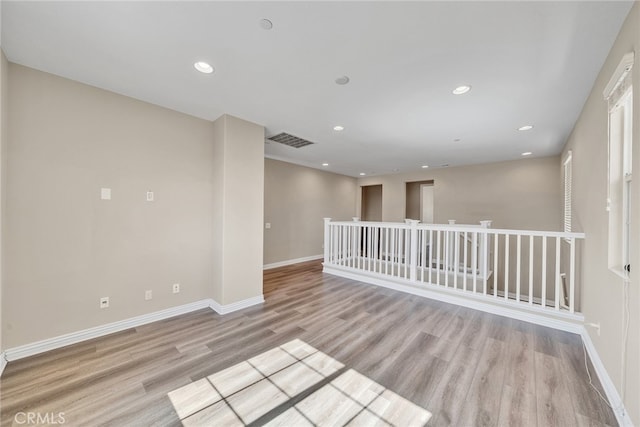 unfurnished room featuring light hardwood / wood-style flooring