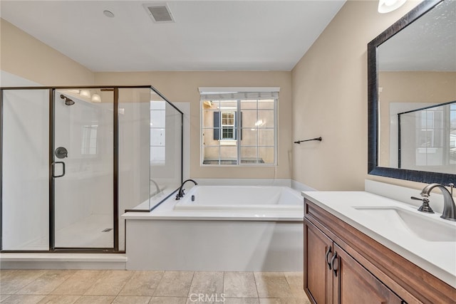 bathroom featuring vanity, tile patterned floors, and independent shower and bath