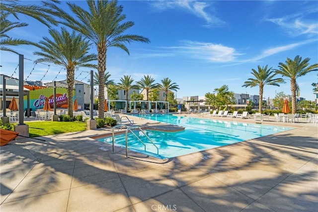 view of swimming pool featuring a patio area