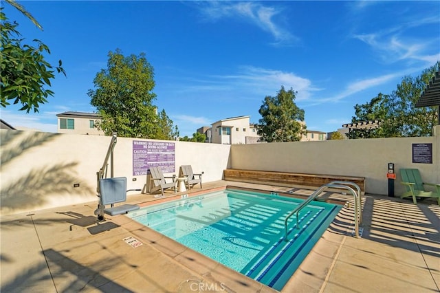 view of swimming pool featuring a patio