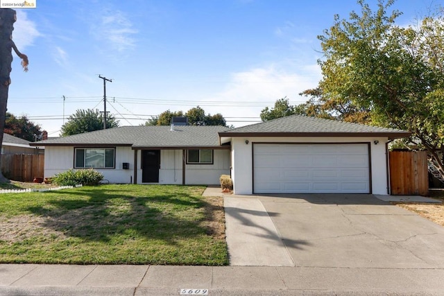 single story home featuring a front yard and a garage