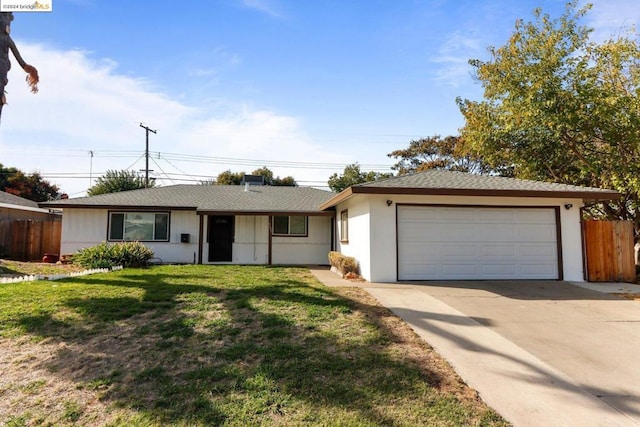 ranch-style home with a front yard and a garage