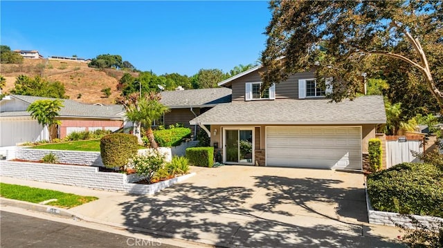 view of front of property featuring a garage