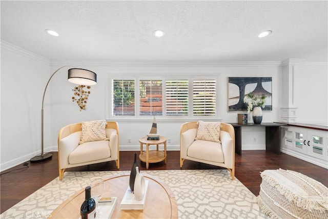 living area with dark wood-type flooring, a textured ceiling, and ornamental molding