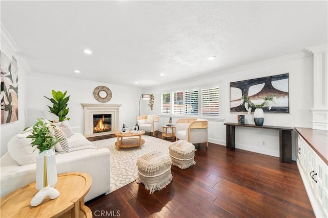 living room featuring dark hardwood / wood-style floors and crown molding