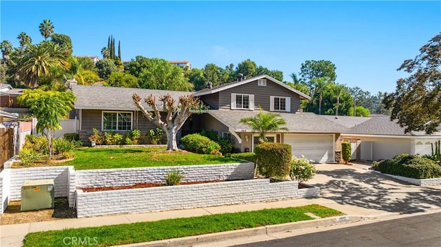 view of front facade featuring a garage and a front lawn