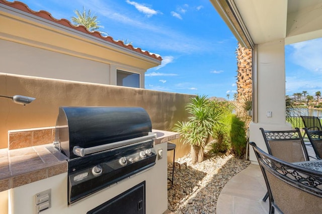 view of patio / terrace featuring an outdoor kitchen and area for grilling