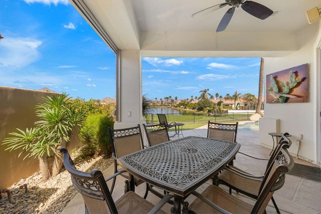 view of patio with a fenced in pool and ceiling fan