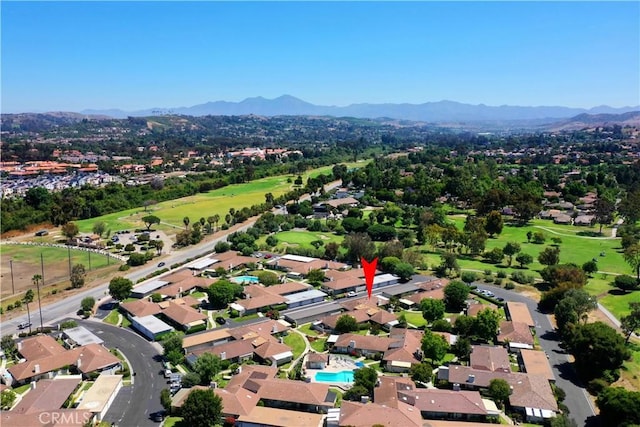 birds eye view of property with a residential view, a mountain view, and golf course view