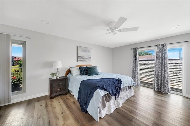 bedroom with access to exterior, ceiling fan, baseboards, and wood finished floors