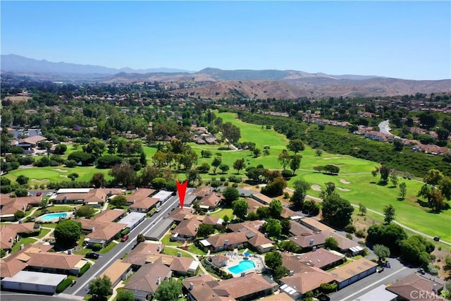 aerial view featuring a residential view, a mountain view, and golf course view