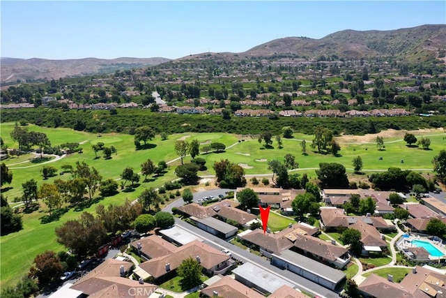 birds eye view of property with a residential view, view of golf course, and a mountain view