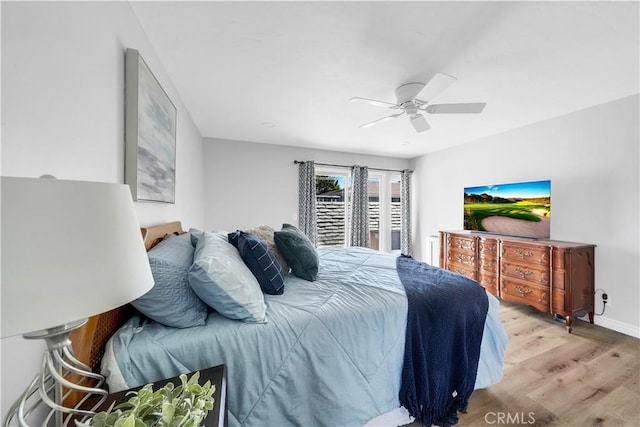 bedroom with ceiling fan and light wood-type flooring