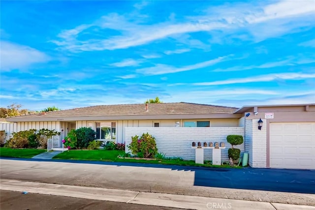 ranch-style house featuring a garage