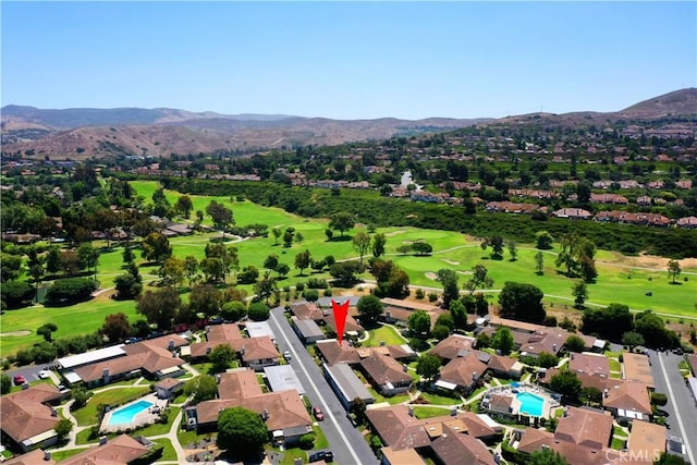 aerial view featuring golf course view, a residential view, and a mountain view