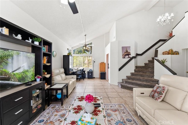 living room with ceiling fan with notable chandelier, high vaulted ceiling, and light tile patterned flooring