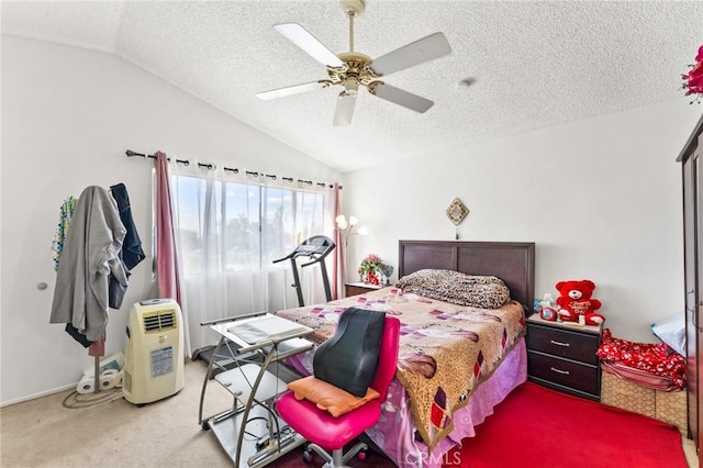 bedroom featuring a textured ceiling, ceiling fan, lofted ceiling, and carpet floors