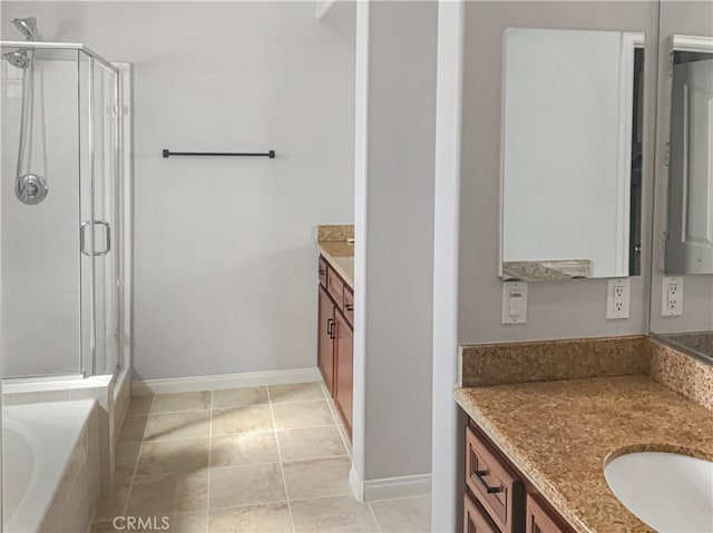 bathroom with vanity, shower with separate bathtub, and tile patterned floors