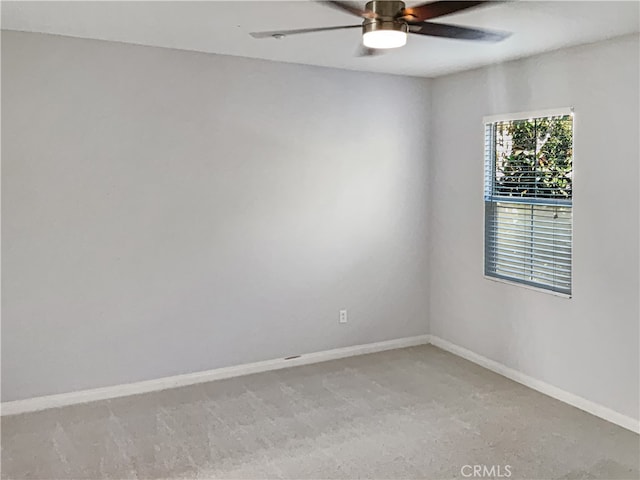 empty room with light carpet and ceiling fan