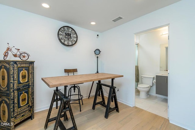 office space featuring visible vents, recessed lighting, baseboards, and light wood-type flooring