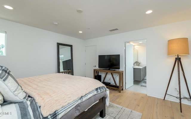 bedroom featuring visible vents, recessed lighting, and light wood-style flooring