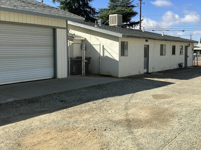 view of property exterior with central AC