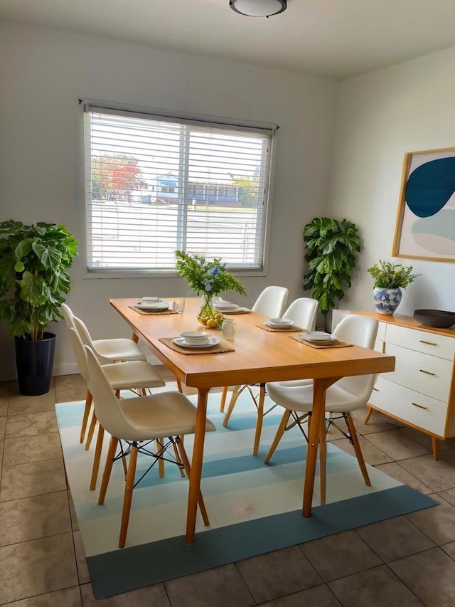 dining room with tile patterned flooring